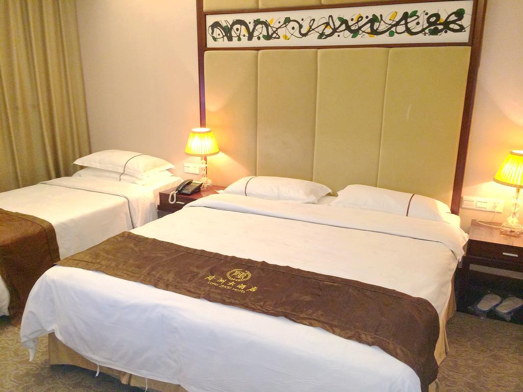 Long Zhou Grand Hotel Kuangcsou Szoba fotó
