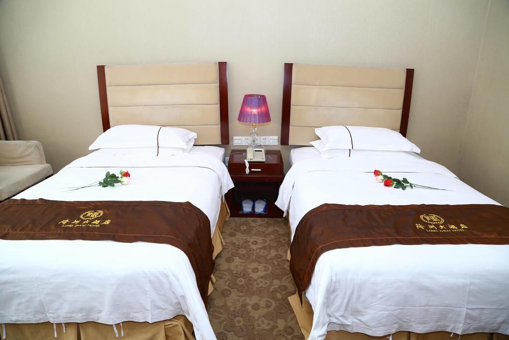Long Zhou Grand Hotel Kuangcsou Szoba fotó