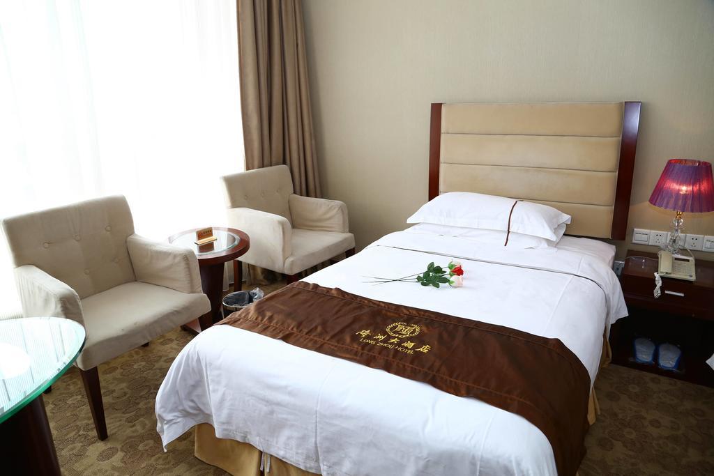 Long Zhou Grand Hotel Kuangcsou Szoba fotó